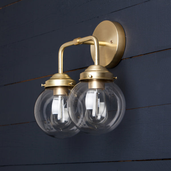 Double Clear Glass Globe Brass Wall Sconce